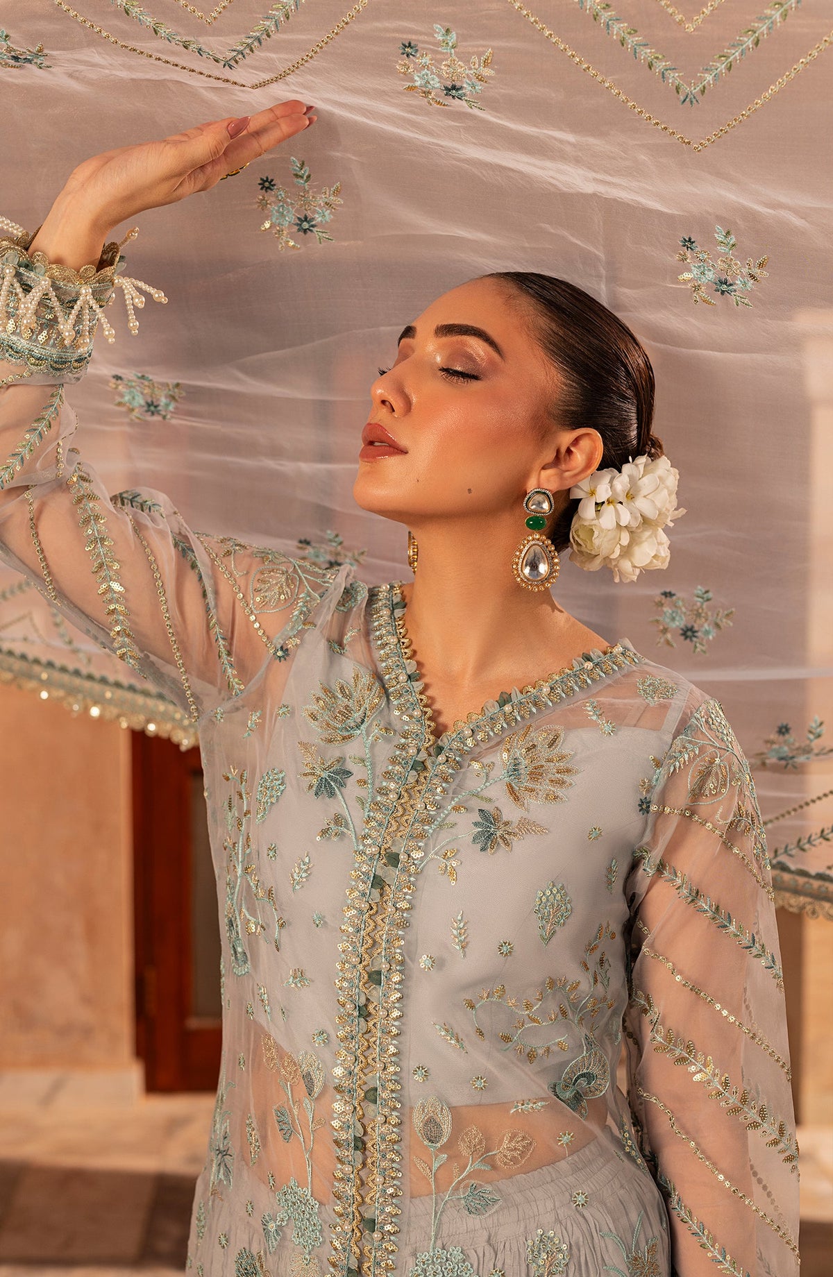 Close-up of model highlighting fabric details of Aylin Aqua formal dress