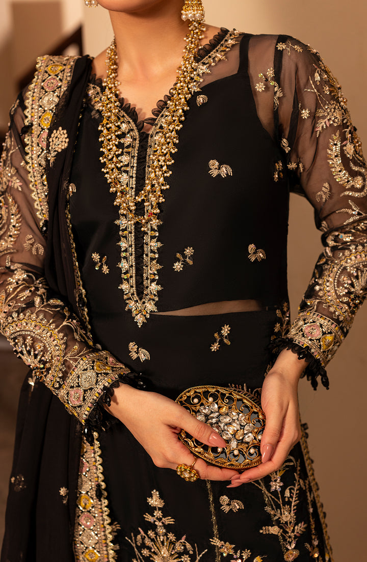 Close-up of model displaying fabric details of Aylin Dusky formal dress